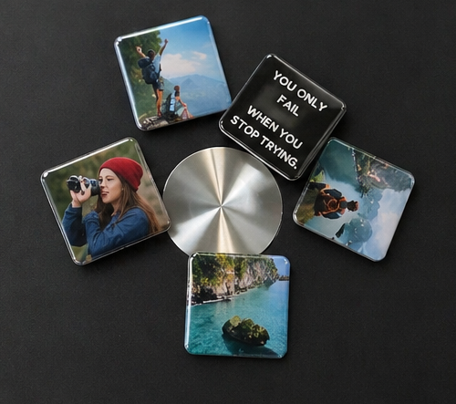Set of square coasters with scenic and motivational designs on a dark surface